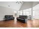 Spacious living room with a high ceiling, hardwood floors, and an open layout, perfect for entertaining and relaxation at 1004 E Sandy Ridge Rd, Monroe, NC 28112