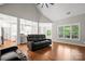 Bright, airy living room features hardwood floors, an open concept, and seamless integration with the adjacent kitchen and dining areas at 1004 E Sandy Ridge Rd, Monroe, NC 28112