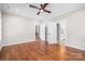 Spacious main bedroom with hardwood floors, recessed lighting, and ensuite bathroom access at 1004 E Sandy Ridge Rd, Monroe, NC 28112
