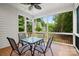 Covered porch with a table and chairs, offering a relaxing outdoor space at 1004 E Sandy Ridge Rd, Monroe, NC 28112