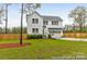 Charming two-story home with a well-manicured lawn and a modern two-car garage at 10339 Lakeshore Dr # 85, Lancaster, SC 29720