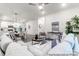 Bright open-concept living room showcasing modern décor and seamless flow to the kitchen and dining area at 10339 Lakeshore Dr # 85, Lancaster, SC 29720