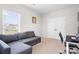 Bedroom with a gray sectional couch, desk, and closet at 106 Tuppy Ct, Statesville, NC 28625