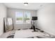 Bright bedroom featuring a bicycle and large mirror at 106 Tuppy Ct, Statesville, NC 28625