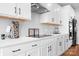 Modern kitchen featuring white cabinets, stainless steel appliances, and sleek countertops at 106 Tuppy Ct, Statesville, NC 28625