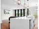 Open kitchen featuring an island with seating, stainless steel appliances, and hardwood floors at 106 Tuppy Ct, Statesville, NC 28625