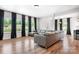 Spacious living room with hardwood floors, modern furnishings, and abundant natural light at 106 Tuppy Ct, Statesville, NC 28625