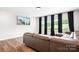 Comfortable living room with a large leather sectional couch and a wall-mounted television at 106 Tuppy Ct, Statesville, NC 28625