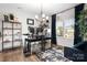 Bright office space with built-in shelving, modern lighting, and a large window at 106 Tuppy Ct, Statesville, NC 28625