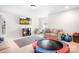 Large playroom featuring a couch and flat screen television at 106 Tuppy Ct, Statesville, NC 28625