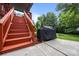 The backyard features convenient access stairs and a barbecue grill, perfect for outdoor entertaining and summer cookouts at 10919 Valley Spring Dr, Charlotte, NC 28277