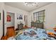 Bedroom with gray wooden floors, wooden dresser and a window at 10919 Valley Spring Dr, Charlotte, NC 28277
