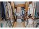 Walk-in closet with shelves and clothing racks at 10919 Valley Spring Dr, Charlotte, NC 28277