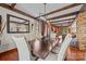 Elegant dining room featuring wood floors, beams and a decorative mirror at 10919 Valley Spring Dr, Charlotte, NC 28277