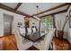 Dining room featuring a large table, comfortable chairs, hardwood floors, and natural light at 10919 Valley Spring Dr, Charlotte, NC 28277