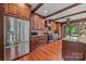 Gourmet kitchen featuring stainless steel appliances, custom cabinets, and a granite countertop island at 10919 Valley Spring Dr, Charlotte, NC 28277