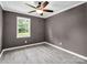 This bedroom offers neutral walls, a ceiling fan, and durable light wood-look flooring at 111 Wolfe Rd, Shelby, NC 28152