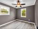 Spacious bedroom with neutral walls, durable light wood-look flooring, and windows offering serene views at 111 Wolfe Rd, Shelby, NC 28152