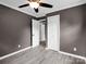 Bedroom showcasing neutral walls, durable light wood-look flooring, closet, and serene ambiance at 111 Wolfe Rd, Shelby, NC 28152