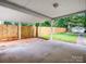 View of the carport featuring a concrete floor and a fenced-in backyard at 111 Wolfe Rd, Shelby, NC 28152