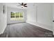 Bright living room with modern flooring, exposed brick accents, and a large window at 111 Wolfe Rd, Shelby, NC 28152