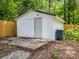 Backyard shed featuring concrete foundation and a white exterior at 111 Wolfe Rd, Shelby, NC 28152