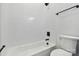 Clean bathroom featuring a tub-shower with subway tile, and toilet with coordinating black fixtures at 113 Woodside Ave, Gastonia, NC 28054