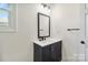 Bathroom boasts a blue vanity with drawers, white countertop, and stylish fixtures at 113 Woodside Ave, Gastonia, NC 28054