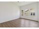 Bright bedroom features wood-look floors, white walls, and a window view at 113 Woodside Ave, Gastonia, NC 28054
