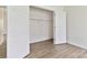 Spacious closet with ample storage features wood-look floors and white walls at 113 Woodside Ave, Gastonia, NC 28054