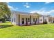 Beautiful house boasting a freshly cut lawn, classic white siding, and dark trim at 113 Woodside Ave, Gastonia, NC 28054