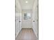 Hallway with two closets and a window providing natural light, creating a bright and open space at 113 Woodside Ave, Gastonia, NC 28054