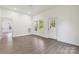 Bright and airy living space with fresh paint, natural light, and wood-look floors throughout at 113 Woodside Ave, Gastonia, NC 28054