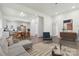 Bright living room showcases open floor plan, modern decor, and seamless flow to kitchen and dining area at 113 Woodside Ave, Gastonia, NC 28054