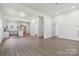 Bright, open-concept space featuring neutral flooring, fresh white walls, and recessed lighting at 113 Woodside Ave, Gastonia, NC 28054