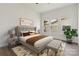 Well staged main bedroom with neutral decor and large windows at 113 Woodside Ave, Gastonia, NC 28054