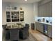 Dining area boasts elegant built-in cabinetry and a mini beverage refrigerator at 11404 James Coy Rd, Davidson, NC 28036