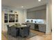 Dining area features custom cabinets, mini fridge, and elegant table with seating at 11404 James Coy Rd, Davidson, NC 28036