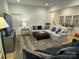 Cozy living room with a comfortable sectional sofa, large screen TV, and stylish decor at 11404 James Coy Rd, Davidson, NC 28036
