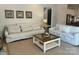 Cozy living room featuring comfortable sofas, a stylish coffee table, and tasteful decor at 11404 James Coy Rd, Davidson, NC 28036