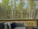 Relaxing outdoor seating area offers serene views of the surrounding trees at 11404 James Coy Rd, Davidson, NC 28036