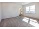 Bright, carpeted bedroom with a large window offers a view of the outdoors at 118 Durham Rd, Stanley, NC 28164