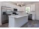 Modern kitchen featuring stainless steel appliances, quartz countertops, and a functional island at 118 Durham Rd, Stanley, NC 28164