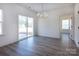 Spacious living room features a sliding glass door for natural light and backyard access at 118 Durham Rd, Stanley, NC 28164