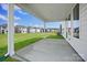 Inviting back patio, perfect for outdoor relaxation with views of a spacious yard and neighborhood at 12009 Grinstead Ln # 303, Charlotte, NC 28278