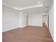 An expansive bedroom with an elegant trey ceiling, pristine white walls and dark hardwood flooring at 12009 Grinstead Ln # 303, Charlotte, NC 28278