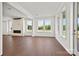 Bright living room boasting a modern fireplace, hardwood floors, recessed lights and lots of natural light at 12009 Grinstead Ln # 303, Charlotte, NC 28278