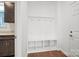 Well-organized mudroom features a built-in bench with cubbies and coat hooks, providing practical storage at 12009 Grinstead Ln # 303, Charlotte, NC 28278