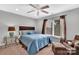 Comfortable bedroom featuring a plush bed, ceiling fan, and natural light from the window at 122 Long Cove Ln, Mooresville, NC 28117