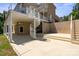 Lovely home features a walkout patio, a spiral staircase leading to a deck, and verdant landscaping at 122 Long Cove Ln, Mooresville, NC 28117